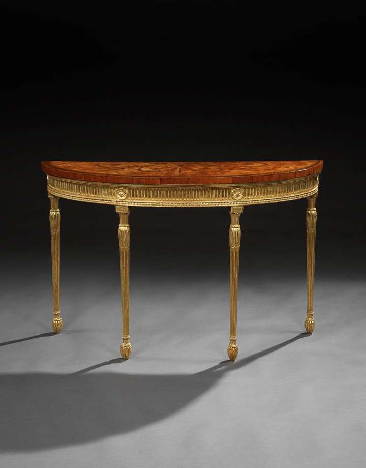 A satinwood marquetry semi-elliptic side table on a giltwood base